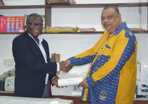 Prof. Gordon presenting the items on behalf of St. Cloud State University’s Aquatic Toxicology Laboratory to Prof. Asiedu (Provost, CBAS)